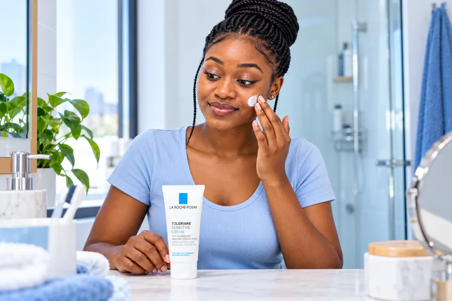 Woman applying La Roche-Posay moisturiser